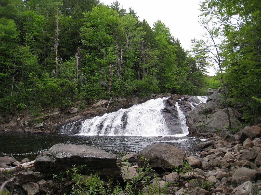 Old Hill Village - South End 555.jpg - In February 1937, residents of Hill Village NH learned that their village, near the Pemigewasset River, was to become a flood control reservoir for the Franklin Falls dam project. To accommodate the construction of the Franklin Falls Dam, the village of Hill NH was to be relocated. By January of 1940, the citizens of Hill NH formed an association, purchased land, and began planning a new model village with the help of the NH State Planning and Development Commission. Construction started in 1940, and by June of 1941 the new town hall and school were completed, along with the streets, water system, and 30 houses. The 1941 town meeting was called to order in the old town hall, recessed, and reconvened in the new village.